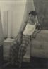 Male seated on the wooden block by Lionel Wendt contemporary artwork Photography