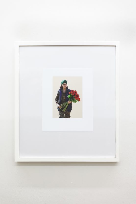 YPJ fighter handing out roses to women rescued from ISIS on International Womens Day 8th March 2017 by Michael Wilkinson contemporary artwork Sculpture