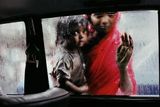 Mother and child looking in through a taxi window Bombay India by Steve Mccurry contemporary artwork photography