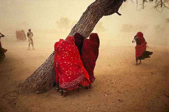 Women seek shelter from the dust storm Rajasthan India by Steve Mccurry contemporary artwork Print
